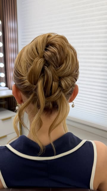Detailed blonde braided updo viewed from behind